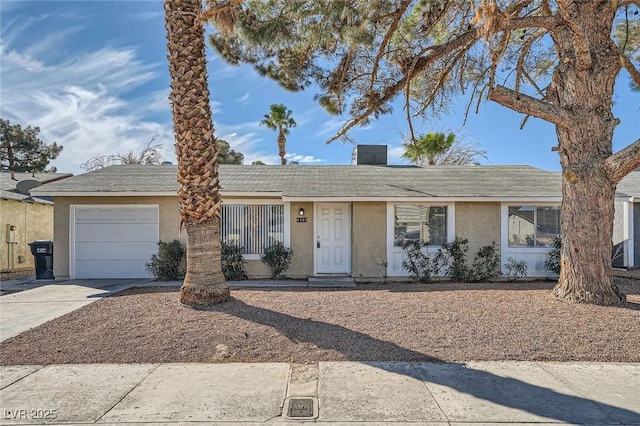 ranch-style home with stucco siding, driveway, and an attached garage