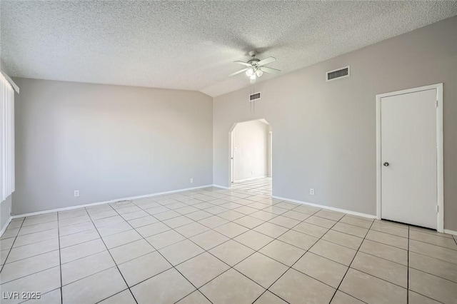 unfurnished room with a ceiling fan, visible vents, lofted ceiling, arched walkways, and a textured ceiling