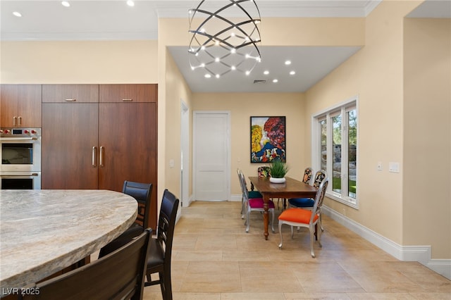 dining space with visible vents, baseboards, and ornamental molding