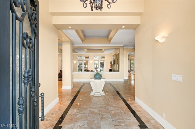 entryway with recessed lighting, a tray ceiling, baseboards, and marble finish floor