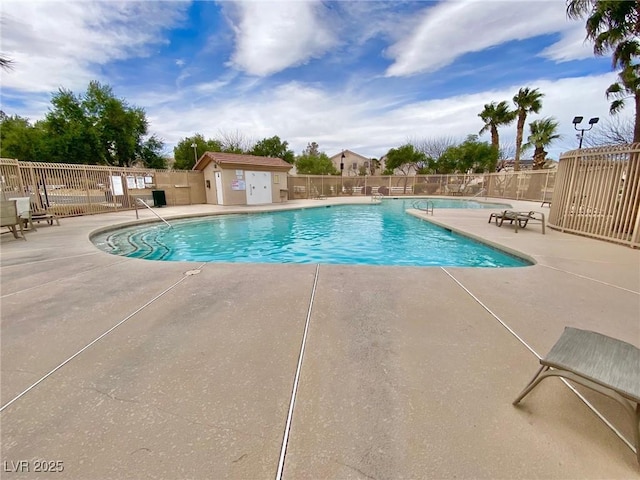 pool featuring a patio and fence