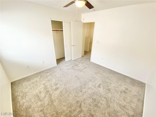 unfurnished bedroom featuring a closet, a ceiling fan, baseboards, and carpet floors