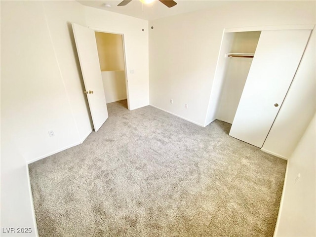 unfurnished bedroom featuring a closet, a ceiling fan, and carpet floors