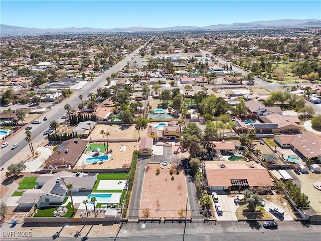 aerial view featuring a mountain view and a residential view