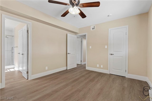 unfurnished bedroom featuring visible vents, baseboards, light wood-style floors, and ceiling fan