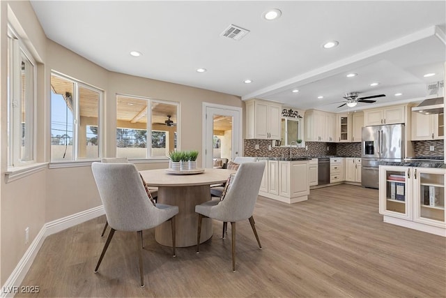 dining area with recessed lighting, light wood-style flooring, visible vents, and baseboards