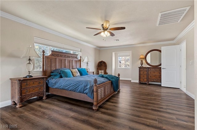 bedroom featuring dark wood finished floors, baseboards, and visible vents