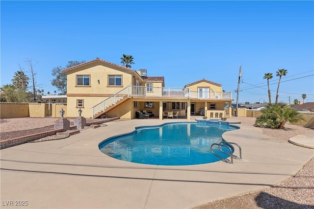 view of swimming pool with stairs, a patio, fence, and a fenced in pool