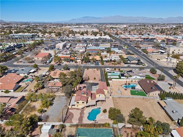 birds eye view of property featuring a mountain view