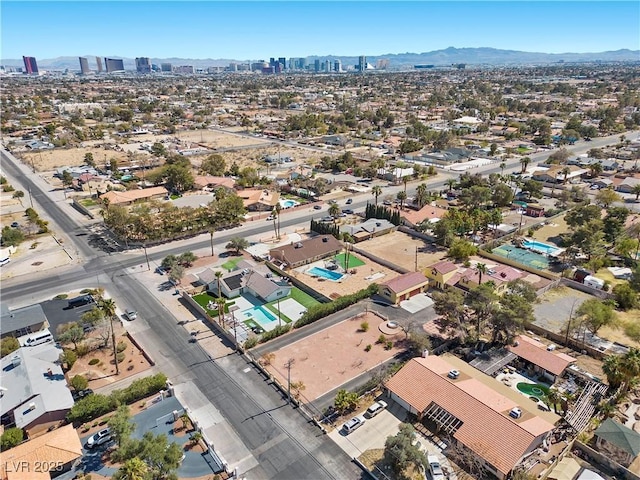 birds eye view of property with a mountain view