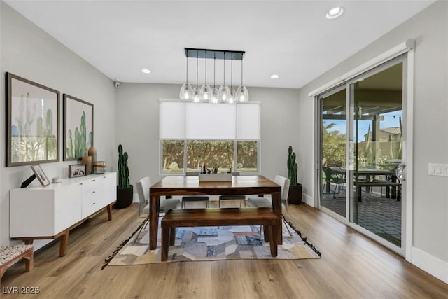 dining area with recessed lighting, baseboards, light wood-style floors, and a healthy amount of sunlight