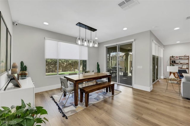 dining space with visible vents, recessed lighting, baseboards, and light wood-style floors