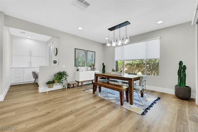 dining area featuring light wood-type flooring, visible vents, baseboards, and recessed lighting