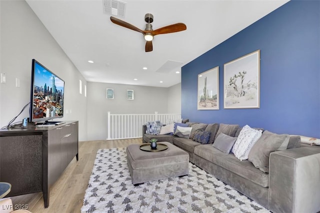 living area featuring visible vents, recessed lighting, light wood-type flooring, and ceiling fan