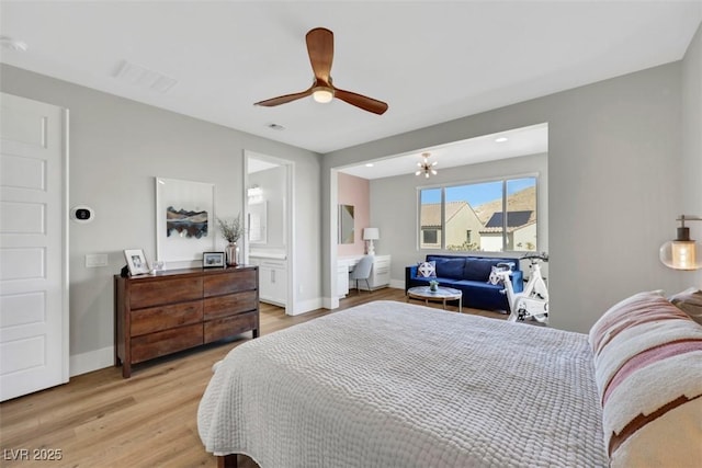 bedroom with ceiling fan, light wood-style floors, visible vents, and baseboards