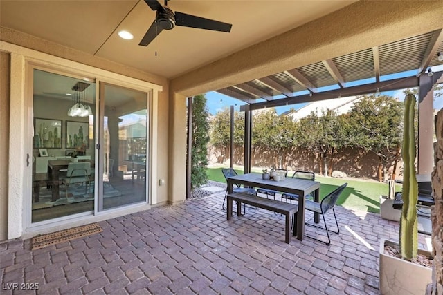 view of patio / terrace featuring outdoor dining area, ceiling fan, and a pergola