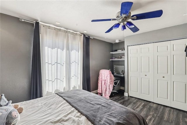 bedroom with ceiling fan, a closet, and dark wood-style floors