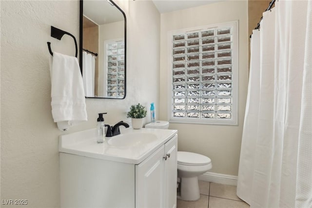 full bathroom featuring tile patterned flooring, toilet, vanity, and baseboards