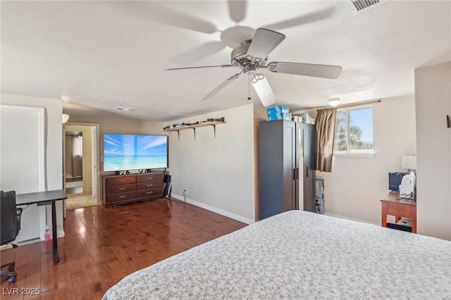 bedroom featuring visible vents, ceiling fan, baseboards, hardwood / wood-style flooring, and fridge