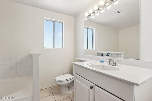 full bath with tile patterned flooring, visible vents, toilet, a bathtub, and vanity