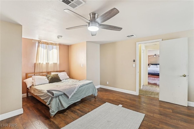 bedroom featuring visible vents, baseboards, and hardwood / wood-style floors