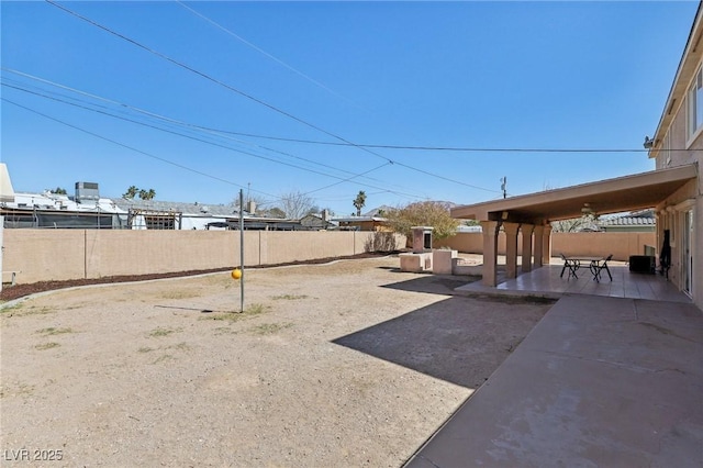 view of yard featuring a patio and a fenced backyard