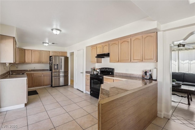 kitchen featuring light brown cabinetry, stainless steel refrigerator with ice dispenser, a sink, under cabinet range hood, and black range with electric cooktop