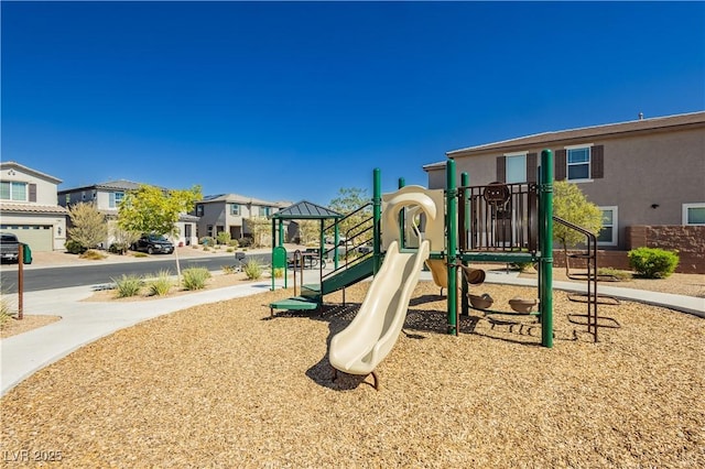 community jungle gym featuring a residential view