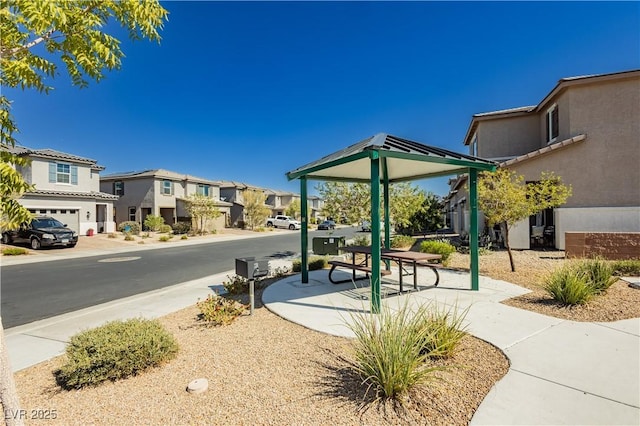 surrounding community featuring a gazebo and a residential view