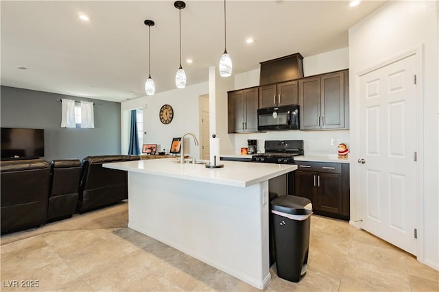 kitchen featuring dark brown cabinets, open floor plan, light countertops, black appliances, and a sink