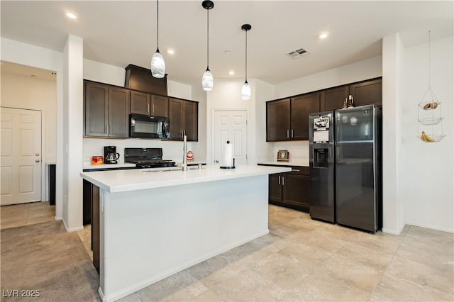 kitchen with black appliances, light countertops, visible vents, and dark brown cabinetry