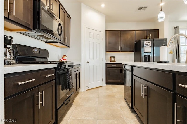 kitchen featuring light tile patterned floors, visible vents, a sink, black appliances, and dark brown cabinets