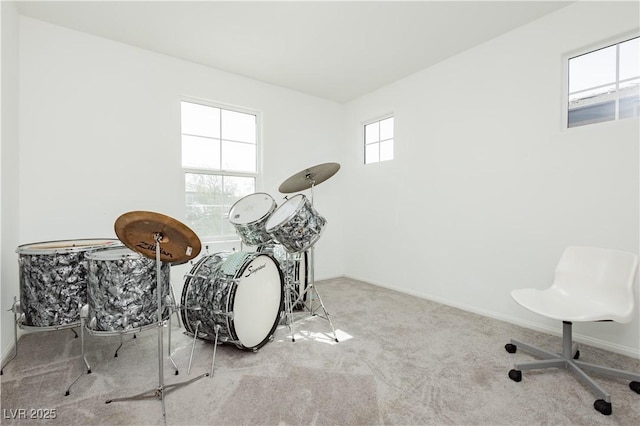 interior space featuring baseboards and carpet floors