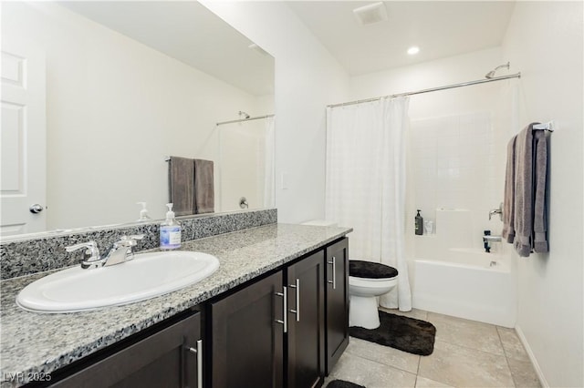 full bathroom featuring vanity, baseboards, shower / tub combo, tile patterned floors, and toilet