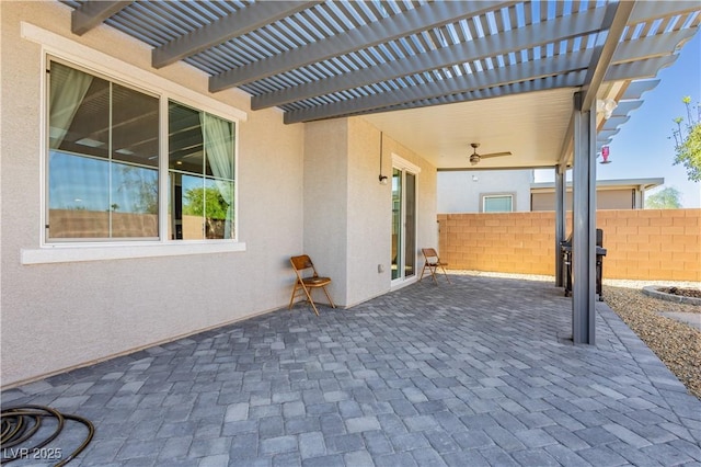 view of patio / terrace featuring a pergola and fence