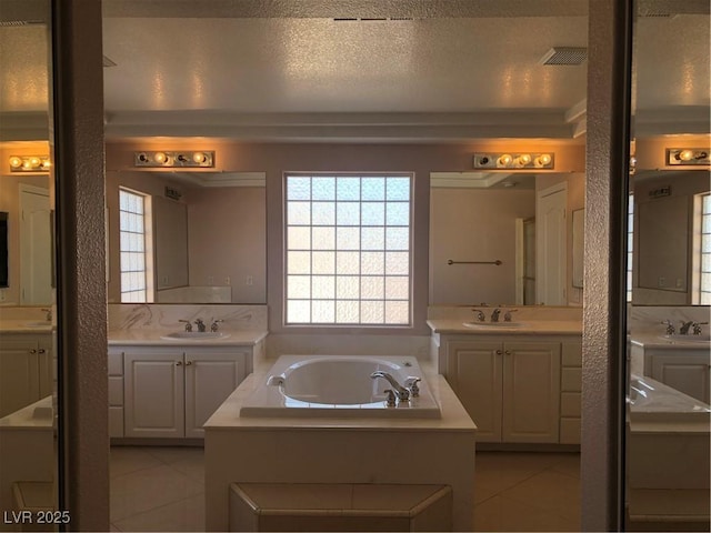 bathroom with tile patterned flooring and a sink