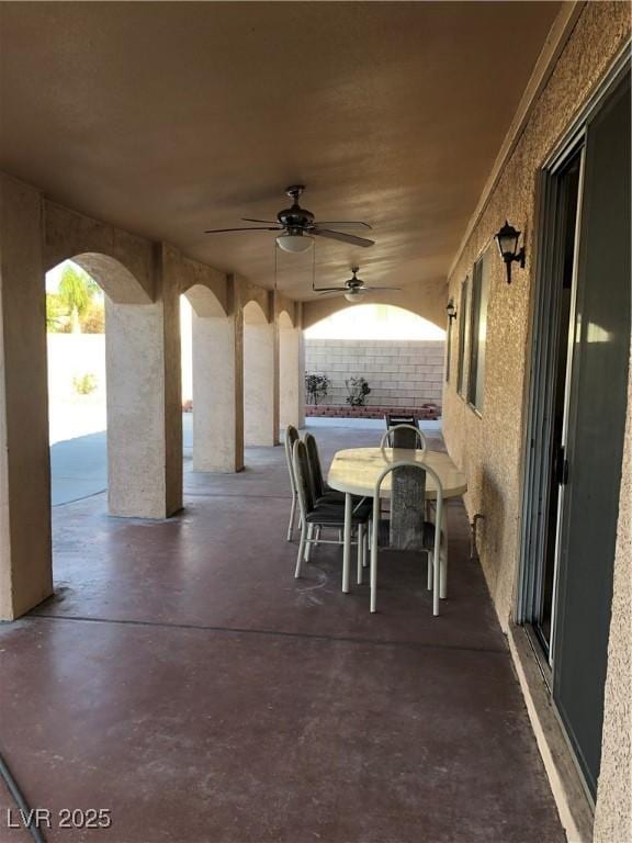 view of patio / terrace with outdoor dining area and ceiling fan