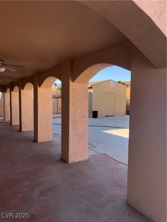 view of patio featuring ceiling fan