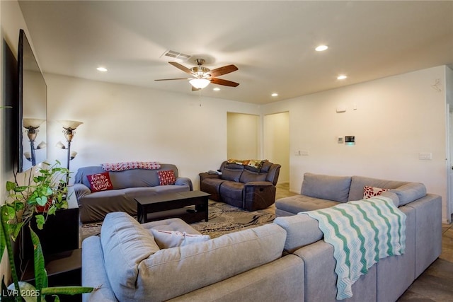 living area featuring a ceiling fan, recessed lighting, and visible vents