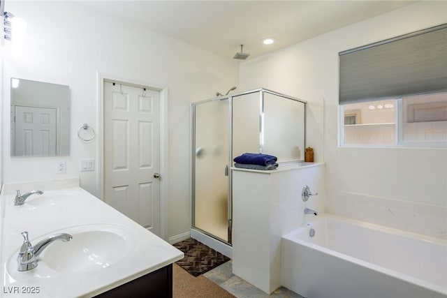 bathroom with a sink, a stall shower, a garden tub, and double vanity