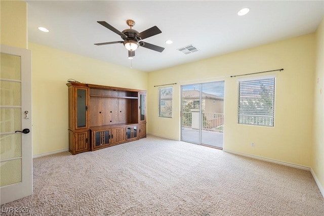 empty room featuring visible vents, baseboards, carpet flooring, recessed lighting, and a ceiling fan