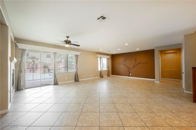 empty room with baseboards, visible vents, light tile patterned flooring, recessed lighting, and ceiling fan