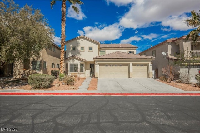 mediterranean / spanish-style home featuring a tiled roof, a garage, concrete driveway, and stucco siding