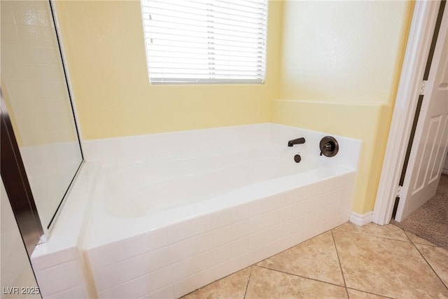 full bathroom featuring tile patterned flooring and a bath