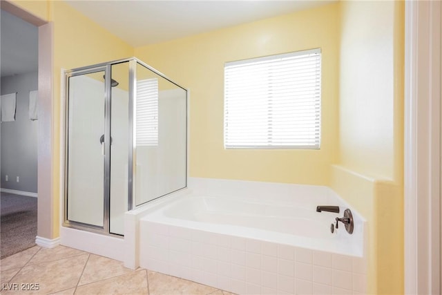 full bathroom with tile patterned floors, a stall shower, and a garden tub