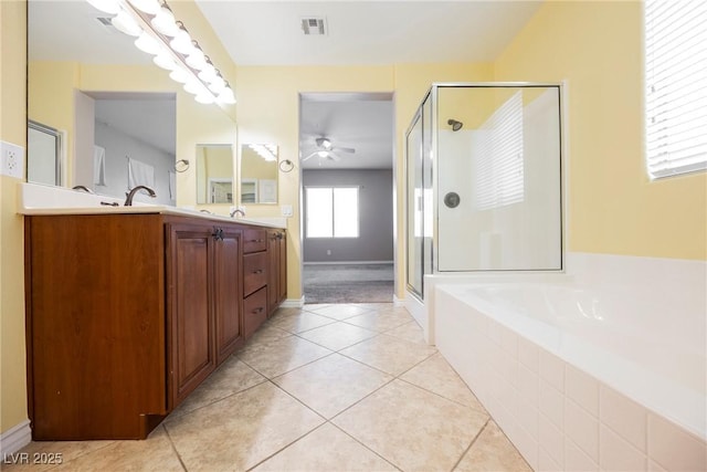 full bathroom with tile patterned floors, visible vents, a stall shower, double vanity, and a bath