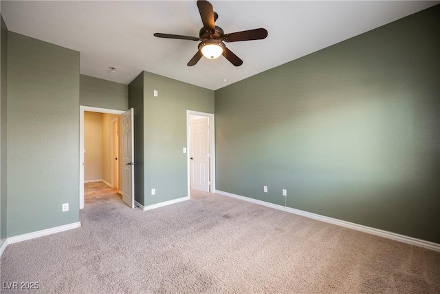 unfurnished bedroom with a ceiling fan, light colored carpet, and baseboards