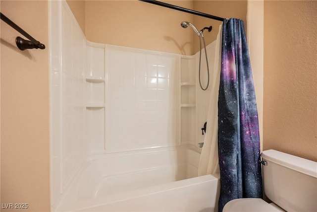 bathroom with shower / tub combo and toilet