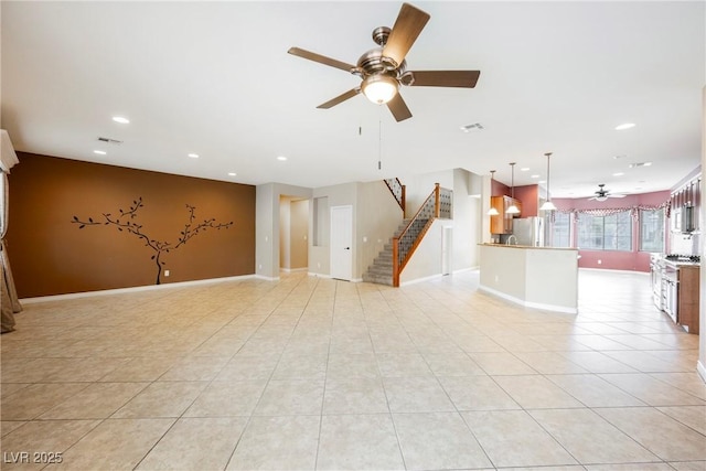 unfurnished living room featuring light tile patterned floors, visible vents, recessed lighting, and stairs