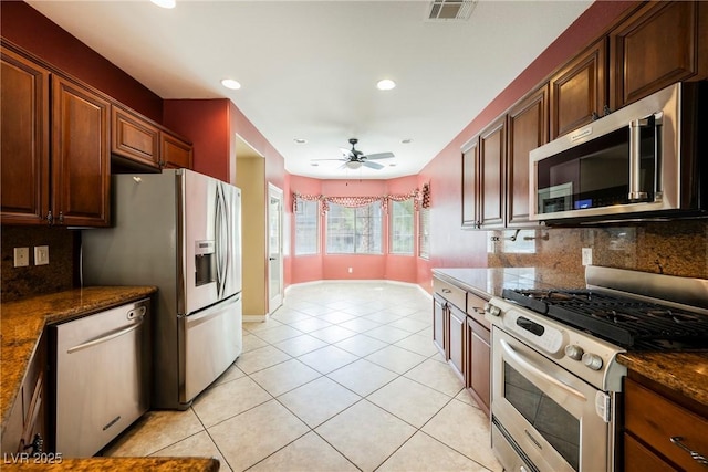 kitchen featuring tasteful backsplash, visible vents, ceiling fan, appliances with stainless steel finishes, and light tile patterned flooring